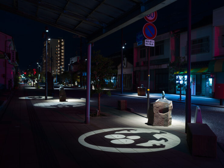 Neon-lit Whimsical Sakaiminato Street at Night
