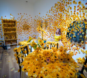 Yayoi Kusamas captivating sunflower installation immerses visitors.