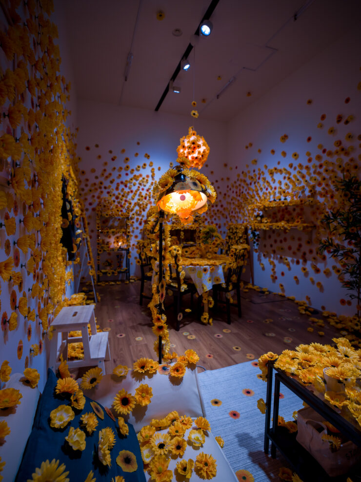 Yayoi Kusamas kaleidoscopic light installation with flower petals.