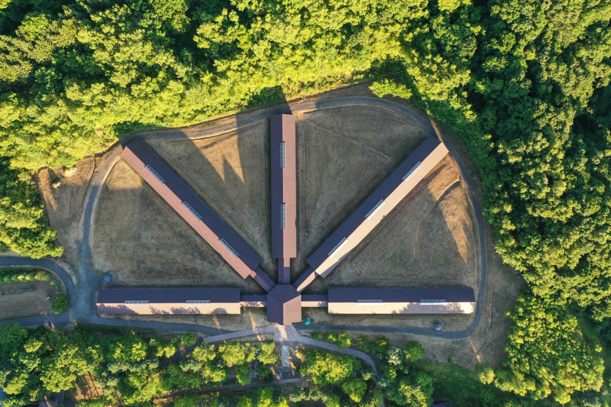 Aerial view of Abashiri Prison in Hokkaido, Japan, showing radial panopticon-style cell blocks.