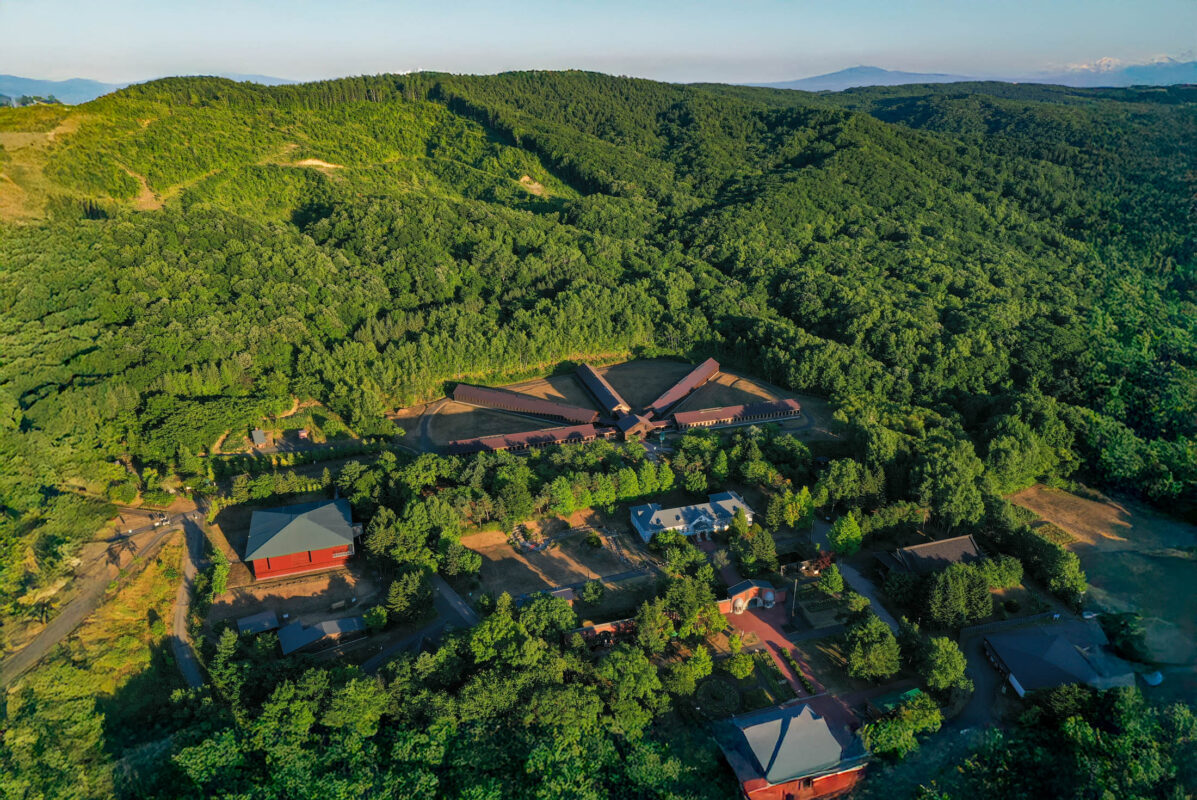 Aerial view of Abashiri Prison’s radial buildings in a forest clearing, Hokkaido Japan.