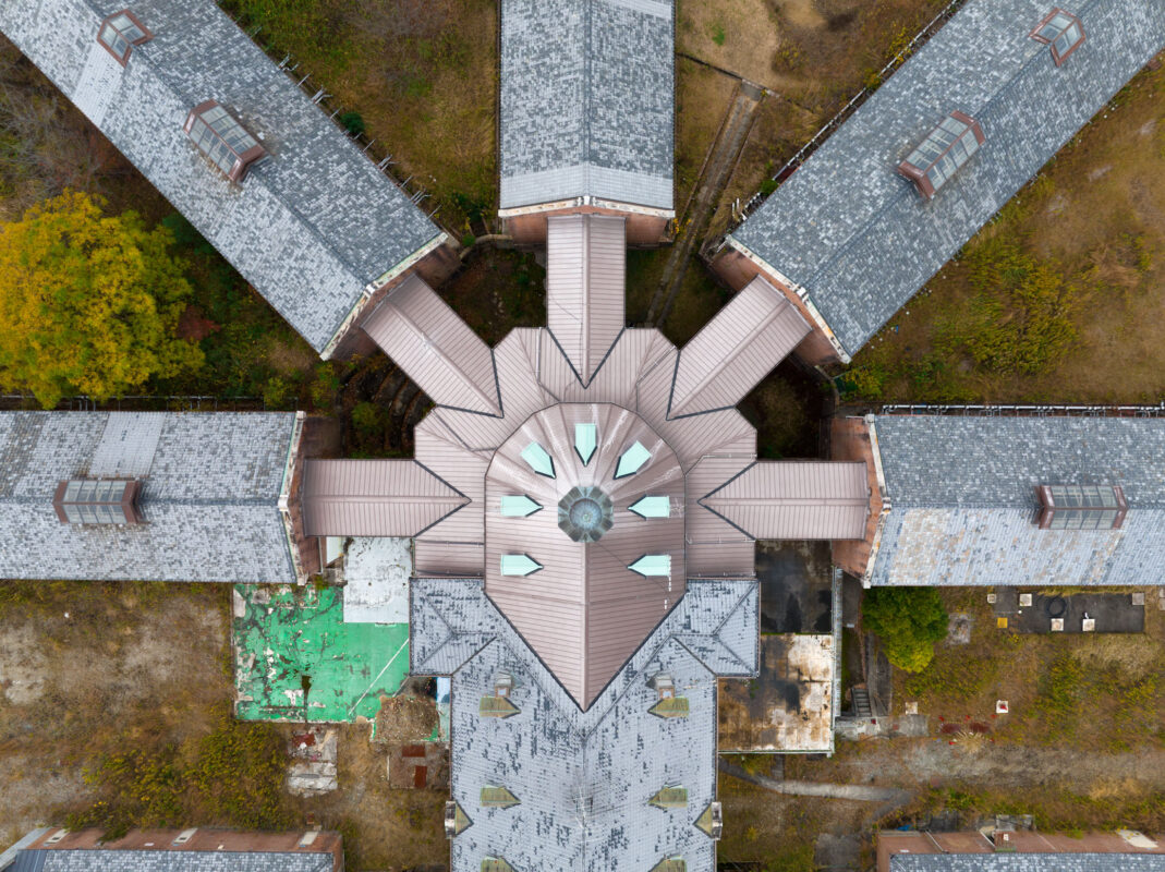Aerial view of Nara Prison panopticon design with central hub and radial wings