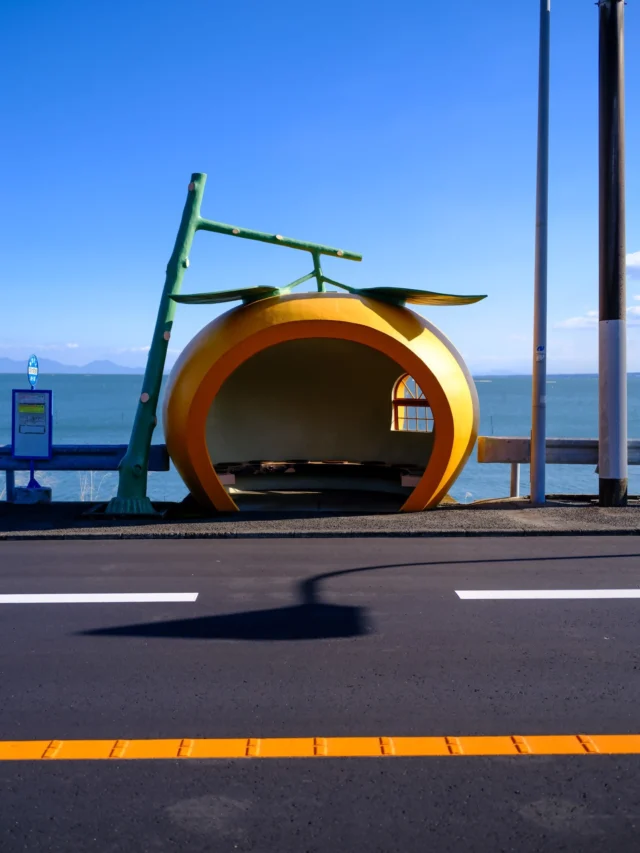 A pop of color brightens the roadside with this charming fruit-shaped bus stop, showcasing Naoshima's unique blend of art and practicality, where every corner holds a piece of its creative spirit.カラフルなフルーツ型のバス停が道端を彩ります。直島では、アートと実用性が見事に融合し、創造的なスピリットがあちこちに漂っています。#Naoshima #offbeatjapan #artisland #creativebusstop #uniquearchitecture #tangerinedream #japan