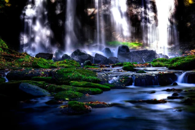 Water's whisper falls, Moss and leaves embrace the stones— Autumn's quiet grace. 水音囁く、 苔葉が石抱く— 秋の静けさ。#SereneWaterfalls #NatureWhisper #MossyGathering #EtherealGlow #WabiSabi #OffbeatJapan #Japan