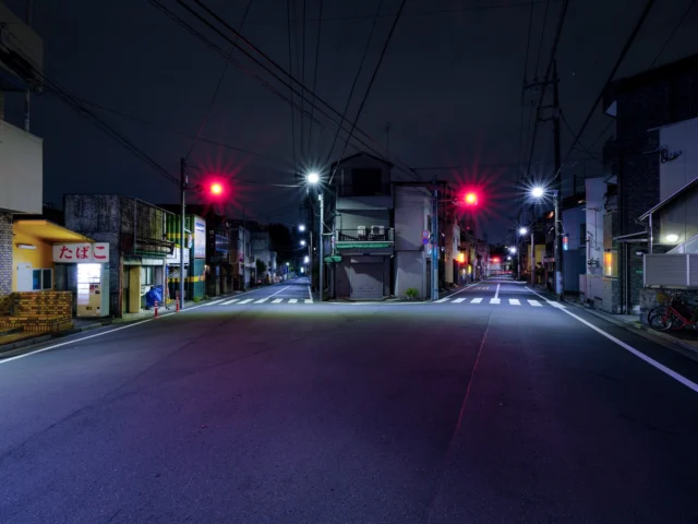 Blue night whispers here, Red lights dance with signs aglow, Takoyaki dreams.  青い夜ささやく 赤い光舞う 看板は輝く たこ焼きの夢  #offbeatjapan #japan #takoyaki #japanstreetnight #urbanserenity #neonnights #suburbansoil #quietstreets